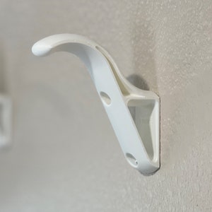 Gancho para colgar en la pared para casco de motocicleta de deportes de motor