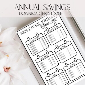 May include: A black and white printable savings tracker for 2026, with calendar boxes for each month. Text includes "Annual Savings" and "2026-Fiver Friday Save £260". A silver pen is placed on the page.