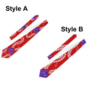 May include: Two red neckties, labeled Style A and Style B, with white backing. Style A features a pattern of purple flowers and pearl necklaces. Style B has a similar design, with a crown and pearl necklace pattern. Both ties are on a white background.