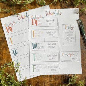 May include: A printable weekly schedule template with colorful letters for each day of the week. The template includes space for activities, reading goals, and a daily schedule.