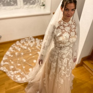 A-Line Wedding Dress with High Neckline Long Sheer Sleeves Floral Lace Appliqués Tulle Floor-Length Skirt “Lina”