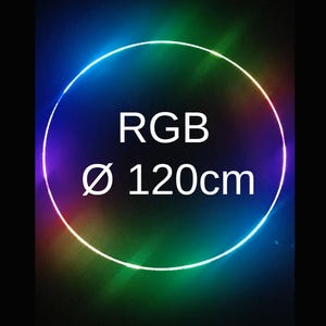 Pode incluir: Um anel LED RGB brilhante, com 120 cm de diâmetro. O anel exibe um espectro de cores vibrantes, incluindo azul, verde e vermelho, contra um fundo escuro. O texto "RGB" e "Ø 120cm" são exibidos no centro.