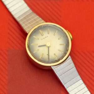 7 inch, Vintage Circular Stylized Two Tone Watch by Timex - O35