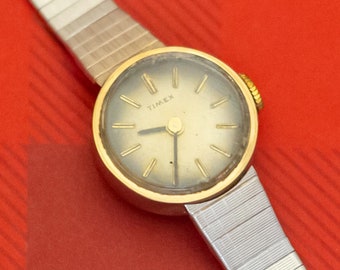 7 inch, Vintage Circular Stylized Two Tone Watch by Timex - O35