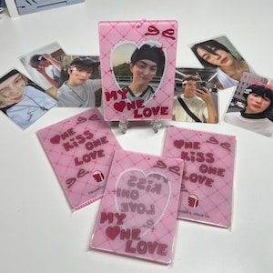 May include: Four pink and white photo card holders with a heart design and the text "My One Love" and "One Kiss One Love".