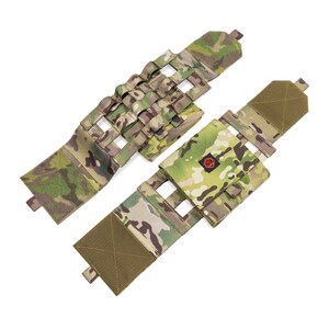 May include: Two camouflage-patterned tactical pouches with adjustable straps and a velcro closure. The pouches have a grid pattern for attaching additional gear.