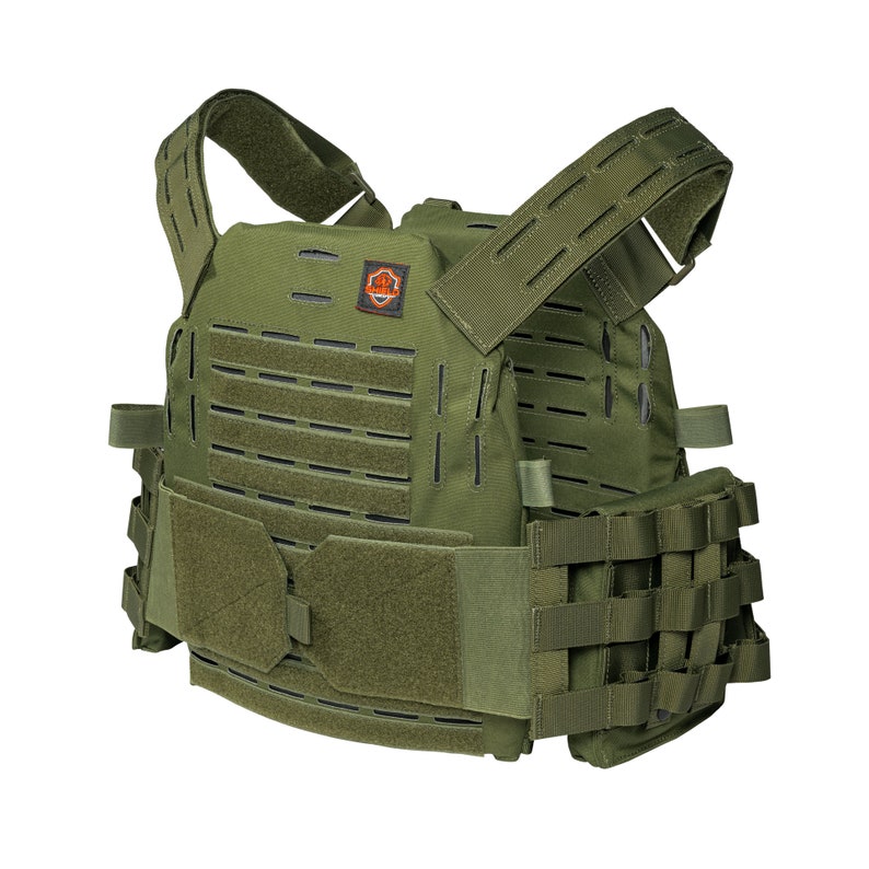 May include: A green tactical vest with adjustable straps and a MOLLE system for attaching pouches. The vest has a patch with the word "OPERATOR" on it.
