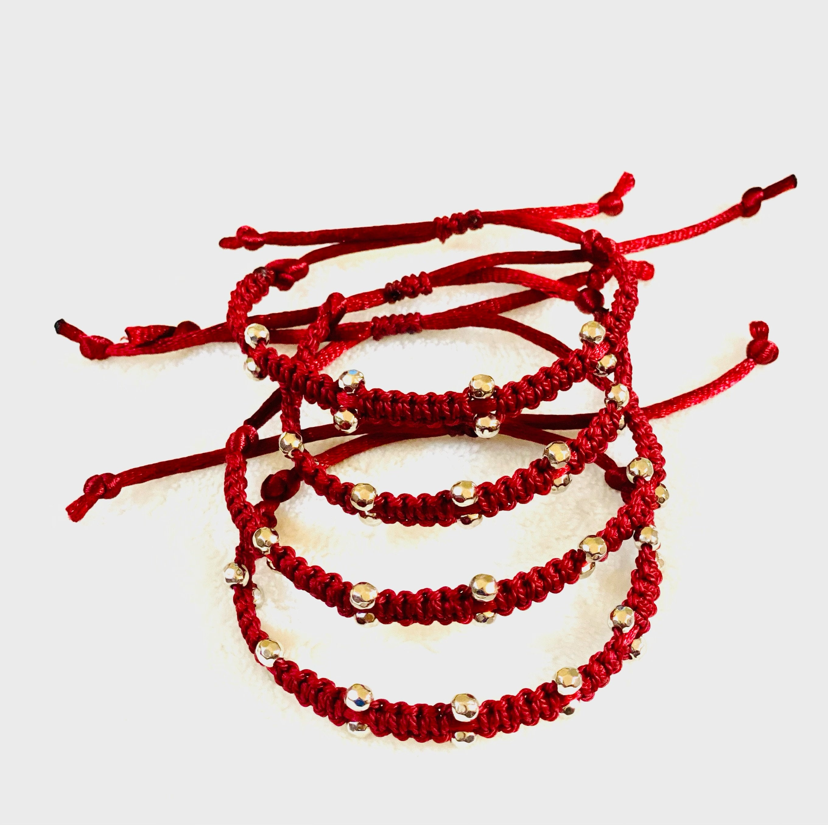 Thread Bracelet in Burgundy Color With Rice Beads. 
