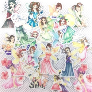May include: A collection of 18 colorful fairy stickers with various poses and wing designs. The fairies are depicted with delicate features, flowing hair, and intricate details. The stickers are perfect for adding a touch of whimsy and magic to any project.