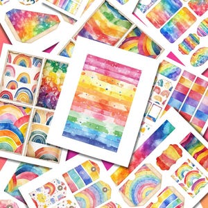May include: A collection of colorful watercolor paper cutouts featuring rainbows, stripes, and various shapes. The designs include gift tags, rectangular cards, and decorative elements in a vibrant palette of rainbow colors.