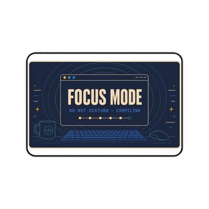 May include: A rectangular desk mat featuring a dark blue background with a central window graphic displaying the text FOCUS MODE, DO NOT DISTURB - COMPILING. It includes a keyboard, a computer mouse, and a coffee mug with code symbols.