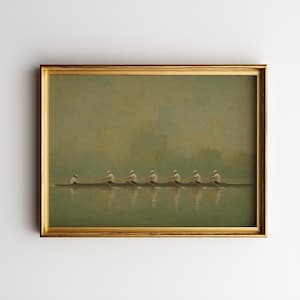 May include: A framed horizontal wall art print depicting a rowing crew in a long boat on calm water. Seven individuals in white shirts and caps are rowing in unison across a muted, foggy green landscape with soft reflections on the water surface.