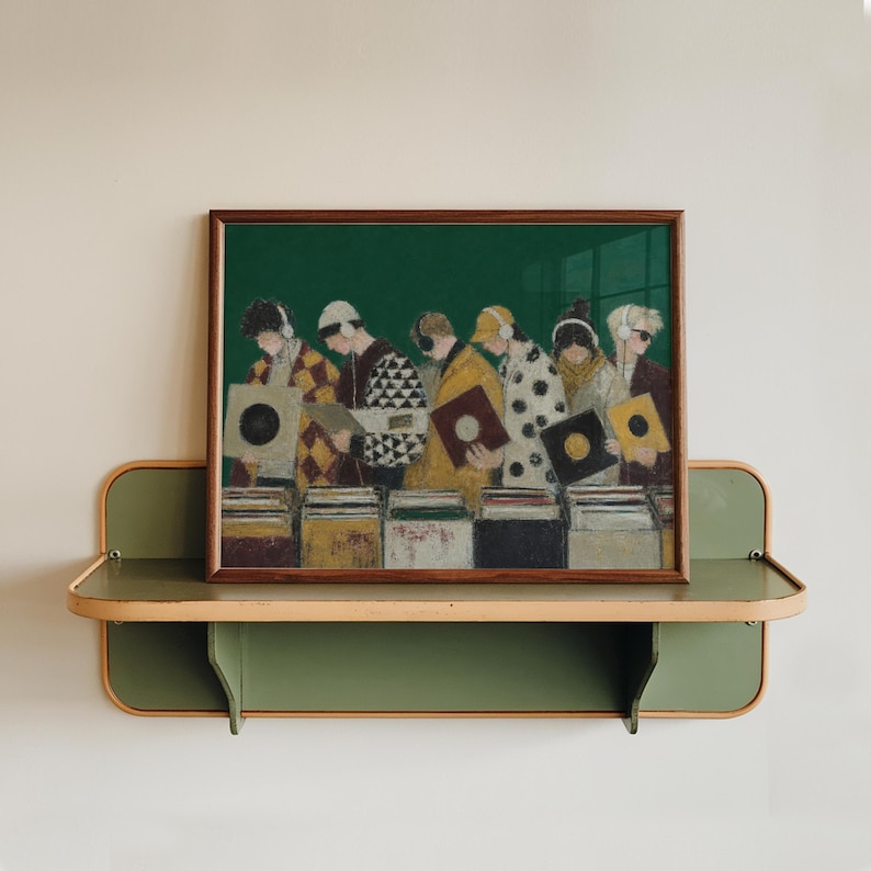 May include: A framed art print featuring an illustration of seven individuals wearing headphones and browsing through vinyl records in crates. The figures are dressed in patterned jackets and coats against a solid dark green background.