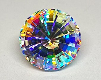 May include: A large, faceted, iridescent gemstone with a rainbow of colors, including blue, green, yellow, orange, and red. The gemstone is cut in a round shape and has a high polish.