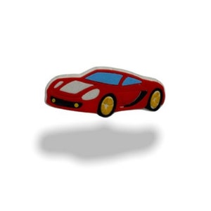 May include: A red toy car with a blue windscreen and yellow wheels.
