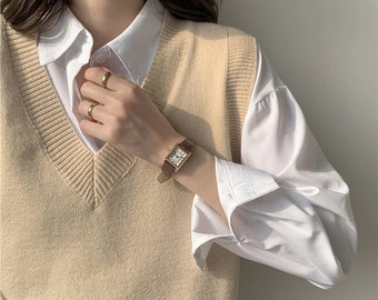 brown sweater vest outfit