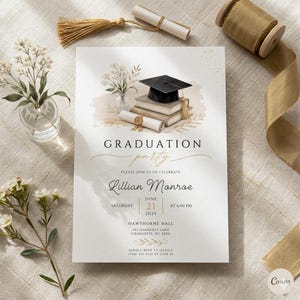May include: A graduation party invitation card featuring a black mortarboard cap on a stack of books, a rolled diploma, and dried floral illustrations. The text reads Graduation party, Lillian Monroe, June 21, 2025, at 6:00 PM, Hawthorne Hall.