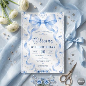 May include: A rectangular birthday invitation card featuring a large watercolor light blue bow at the top, blue text reading Olivia's 6th Birthday, Sun 26 Aug, and party details, accented with small blue bows, stars, and pearls on a white background.