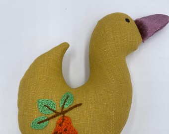 Handmade plush linen stuffed toy with a handmade embroidery