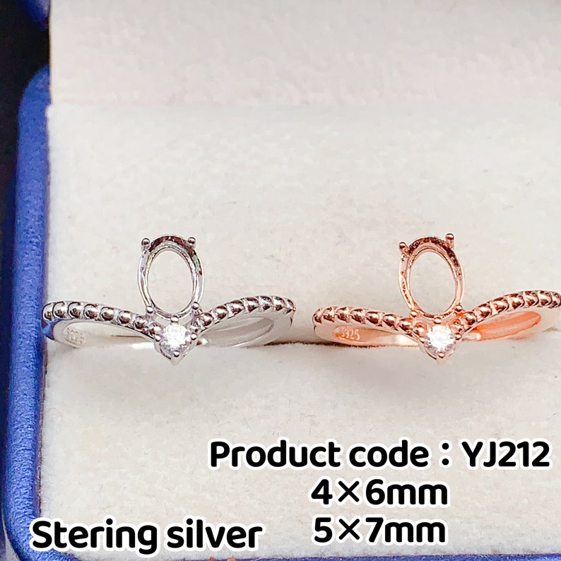 May include: Two sterling silver rings with a prong setting for an oval shaped gemstone. The ring on the left is silver, the ring on the right is rose gold. The rings have a beaded design and a small round stone at the base of the setting. Product code: YJ212 4x6mm 5x7mm