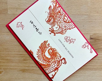 May include: A white card with a red border and a red and orange dragon design. The card says "Love for all seasons".