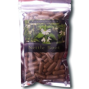 May include: A resealable bag filled with brown capsules labeled "Nettle Root". The bag has a label with a picture of a green plant with white flowers and the text "HEALTHTONICS.CO.UK".