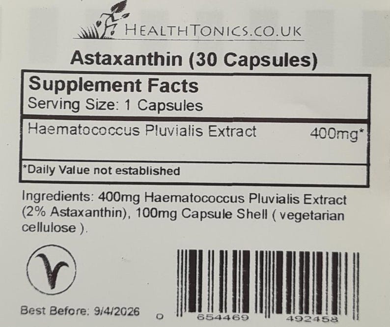May include: A white label with black text that reads "Astaxanthin (30 Capsules)" and "Supplement Facts". The label also includes a list of ingredients, serving size, and daily value information. The label has a barcode and a best before date of 9/4/2026.
