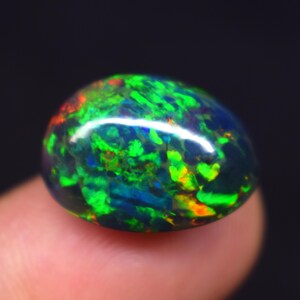 Multi Fire Natural Ethiopian Opal Gemstone, 8.40 Carat Black Smoked Opal Oval Shape Cabochon Size 16.6X12.5X8.8 MM Opal Gemstone.