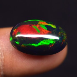 Top Quality Galaxy Multi Fire 7.20 CT Natural Ethiopian Opal Black Smoked Cabochon 19X11.8X6.5 mm Oval Shape Opal Gemstone Jewelry Making