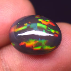 100% Natural Black Ethiopian Opal, 6.2 Carat Multi Fire 14.7x11x7.7 MM, Opal Loose Stone, Honeycomb Fire Ethiopian Opal Cabochon Gemstone.