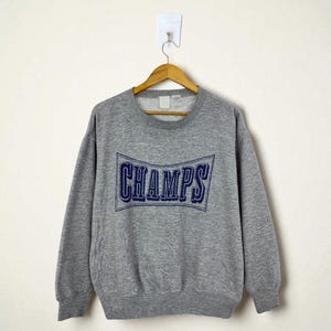 Vintage Grey Sweatshirt with &#39;CHAMPS&#39; Print - Cozy and Stylish, Made in Korea - Free Size, Perfect for Casual Wear, Sports & Street Fashion