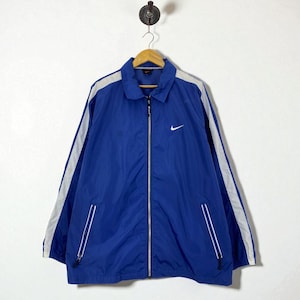 Vintage 90er Jahre Nike Blue Windbreaker Pullover Jacke mit Reißverschlusstaschen Full Zip Front und Iconic Swoosh Size Large Retro Sportswear