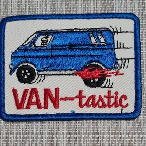 May include: Blue and white embroidered patch with a cartoon van and the text "VAN-tastic".
