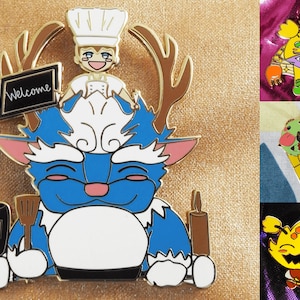 May include: A blue and white enamel pin featuring a cartoon character with antlers, a chef hat, and the word "Welcome" on a sign. The character is holding a spatula and a bottle.
