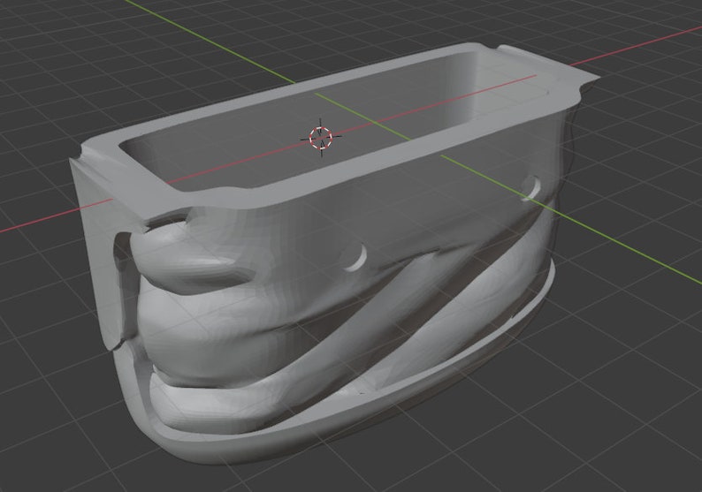 K&ouml;nnte beinhalten: Eine graue, 3D-gedruckte Form f&uuml;r einen Plastikbeh&auml;lter. Die Form hat einen glatten, abgerundeten Innenraum und eine strukturierte Au&szlig;enseite.