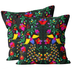May include: Two black throw pillows with a colorful embroidered design of peacocks and flowers. The design features bright colors like red, yellow, green, blue, and purple.