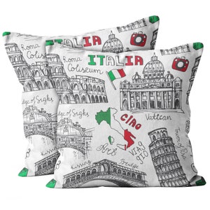 May include: Two white pillowcases with a black and white sketch of Italian landmarks, including the Colosseum, the Leaning Tower of Pisa, and the Vatican. The pillowcases also feature the words "Roma", "Italia", "Coliseum", "Vatican", "Bridge", "Kissing Bridge", "Ciao", and "Via Gio".