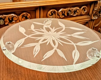 May include: A clear glass cake stand with a frosted floral design and three crystal feet.