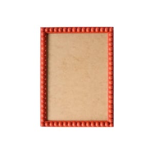 May include: A rectangular picture frame featuring a vibrant orange border decorated with a continuous row of small, uniform spherical beads. The center of the frame contains a plain, light brown rectangular backing board with a smooth texture.