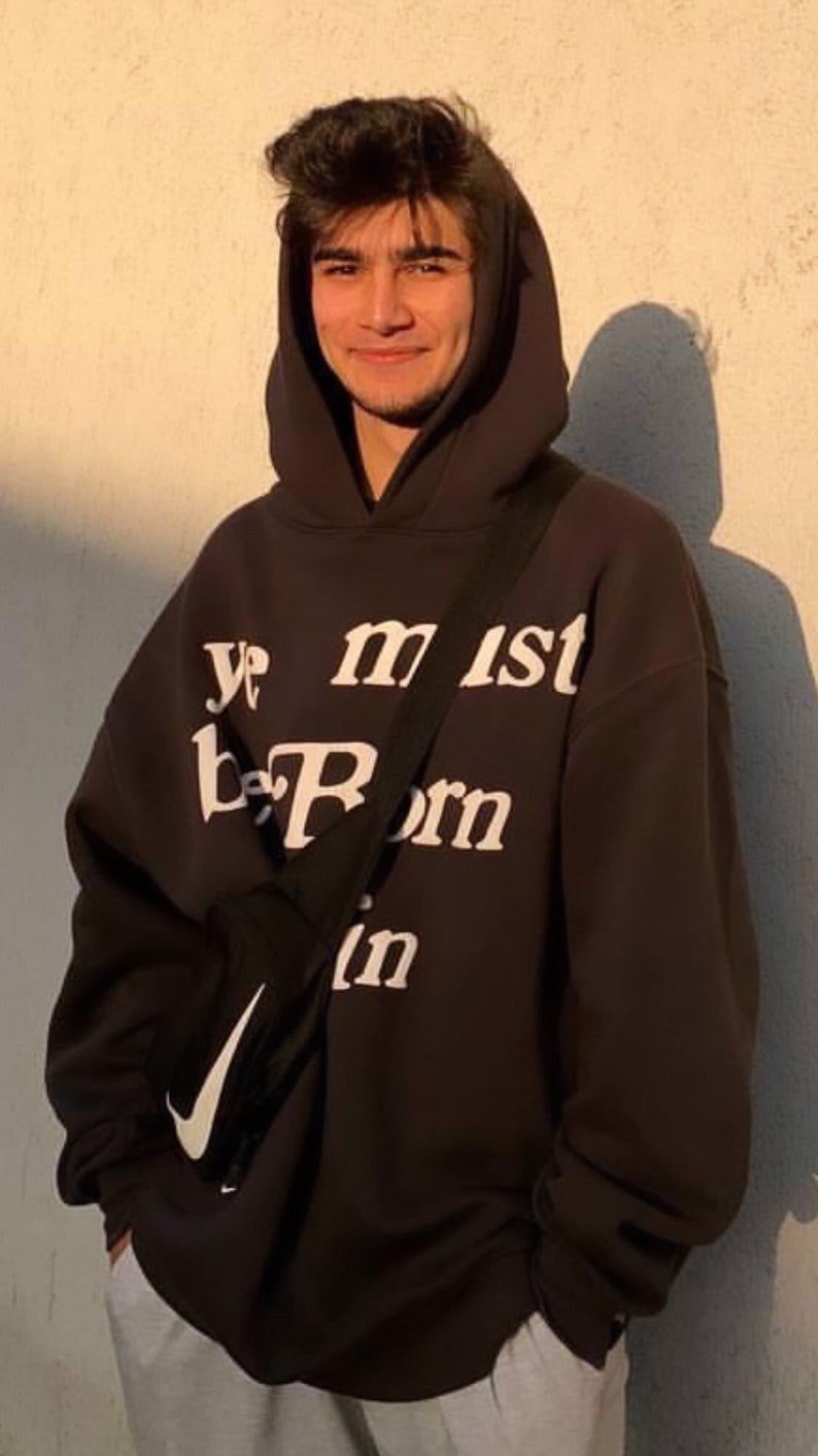 May include: A black hoodie with a white graphic that says "Ye must be born again".