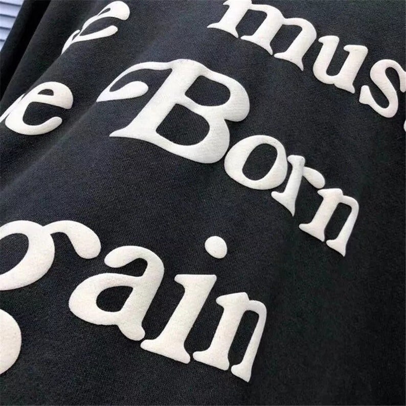 May include: Black sweatshirt with white text that reads "You must be born again".