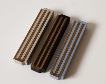 Handmade modern and minimalist mezuzah case. Made of concrete and wood in variety colors, made in Israel.