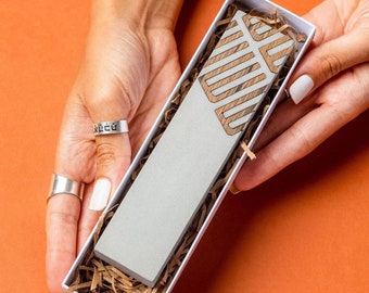 modern mezuzah case . Made of concrete and wood in variety colors, made in Israel. Passover gift