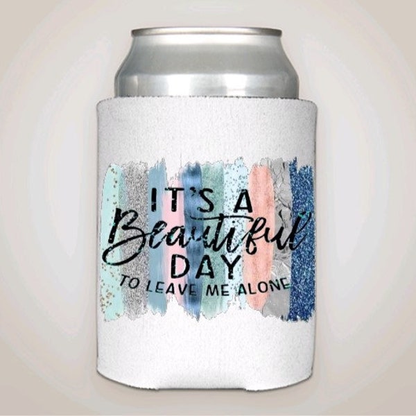 It's a beautiful day to leave me alone can cooler. Blues, pinks and silver color strokes in background. Fits 12 oz cans, long neck bottles