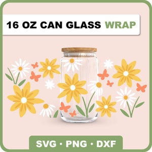 May include: A 16 oz can glass wrap design featuring a floral pattern with yellow and white flowers, green leaves, and orange butterflies. The design is perfect for adding a touch of whimsy to your home decor.