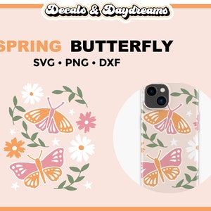 May include: A phone case with a spring butterfly design. The case features a white background with pink and orange butterflies, green leaves, and white flowers. The text "SPRING BUTTERFLY" is at the top of the image.