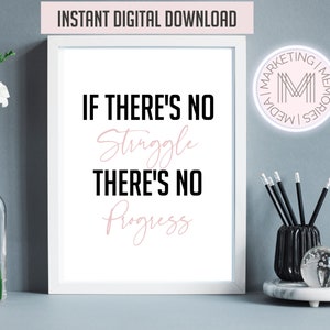 Puede incluir: Una cita imprimible en blanco y negro con texto rosa que dice "If there's no struggle there's no progress". La cita está enmarcada en un marco blanco y está sobre una superficie blanca.