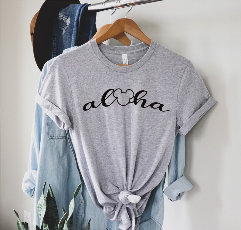 May include: Gray t-shirt with a black Mickey Mouse head and the word "Aloha" written in a cursive font.