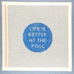 May include: White canvas with a blue circle in the center. The circle has the text "Life is better at the pool" in white.