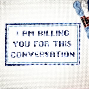 May include: White canvas with blue embroidery that reads "I am billing you for this conversation".